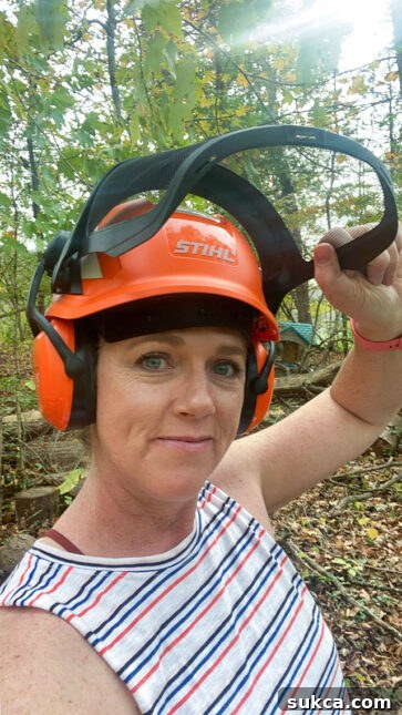 Acreage property maintenance with STIHL Woman working with STIHL power tool on large property