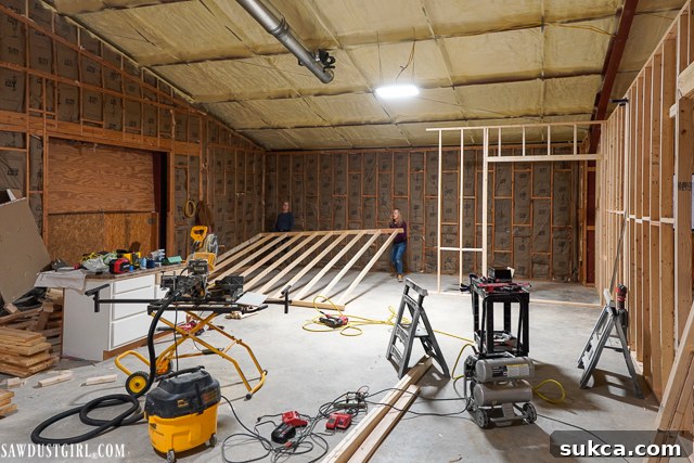 The initial framed structure of the Lodge, showcasing the raw construction phase with exposed beams and open spaces, indicating the start of a major home renovation.