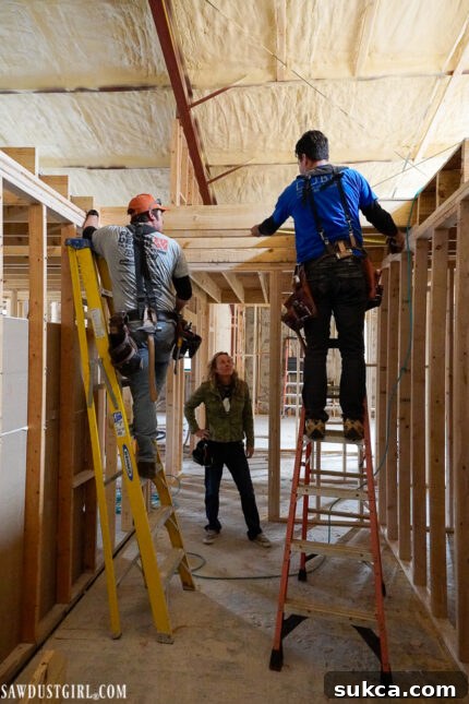 Interior view showing the newly framed walls and the opening for the loft, revealing the potential for an upper level in the Lodge, a key part of the home renovation.