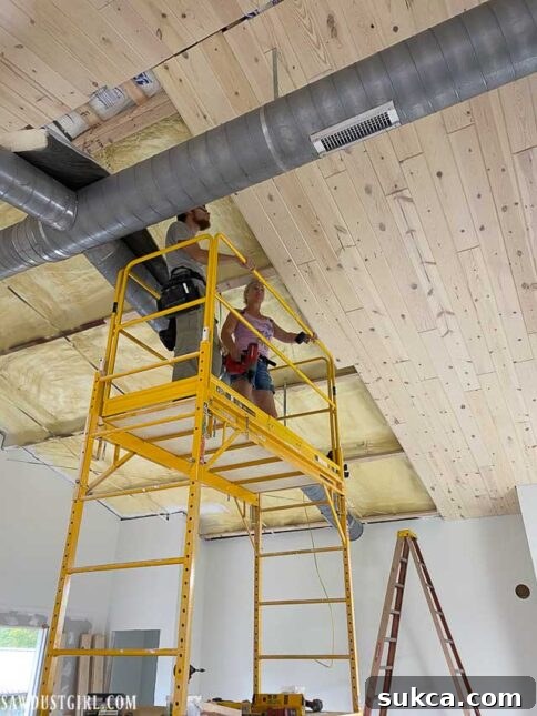 Installing whitewashed pine ceiling in the kitchen/living room