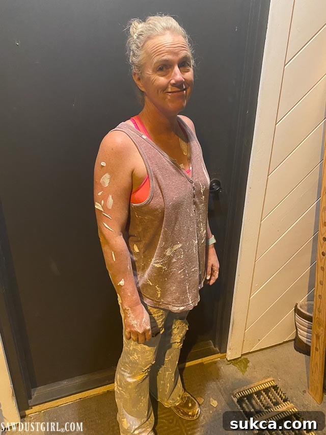 Applying drywall mud in the loft