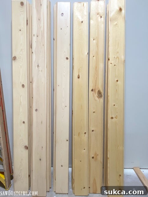 Sanded versus sealed pine planks, illustrating the transformation to a pale Scandinavian finish