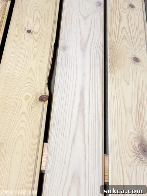 Visual comparison of pine planks with zero, one, and multiple coats of whitewash sealer