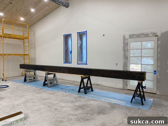 Another view of the stained faux beam sections, highlighting the varied but cohesive finish.
