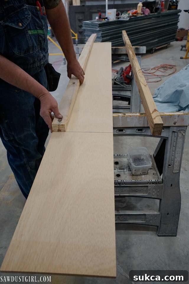 Construction of interlocking nailer cleats using plywood and 2x2 lumber for ceiling installation.
