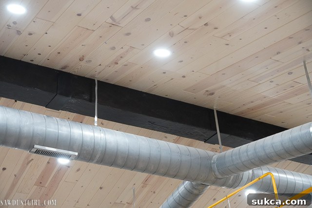 Another perspective of the installed faux beam, highlighting its integration into the room.