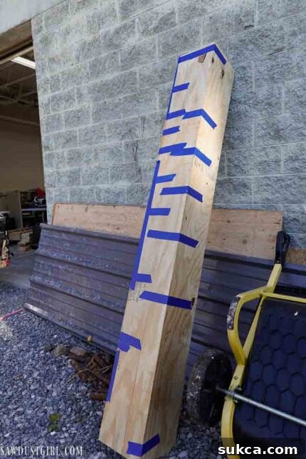 Multiple completed faux beam sections drying and setting after assembly.