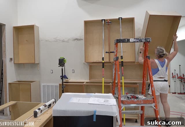 Another view of the upper cabinets and TV area
