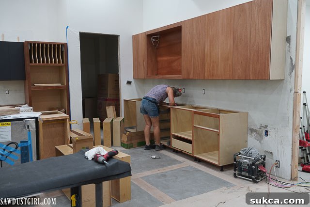 Installed drawer fronts with precision alignment