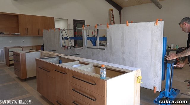 Newly installed concrete kitchen countertops, showcasing their smooth finish and modern aesthetic.