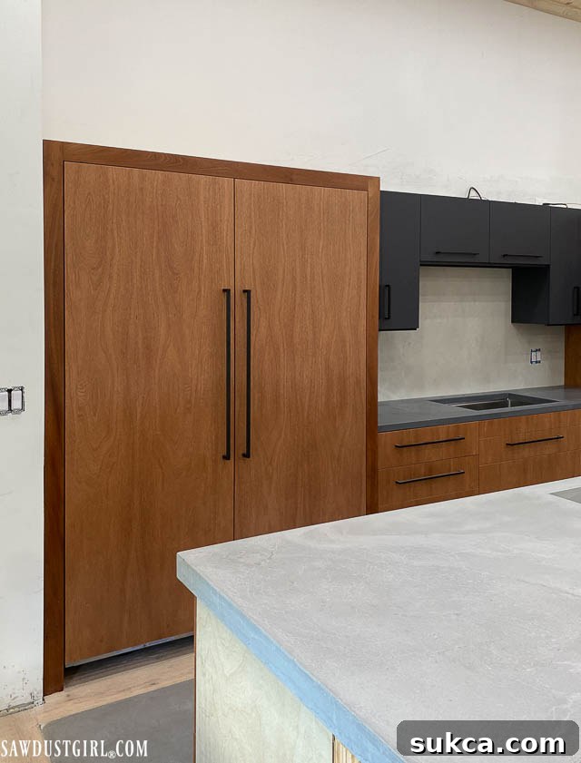 View of the installed refrigeration columns integrated seamlessly into the kitchen design.