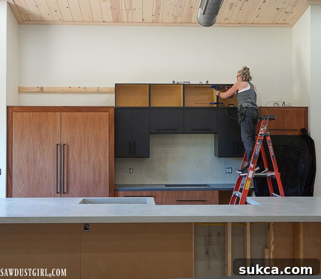 Upper kitchen cabinets being constructed and prepared for installation.