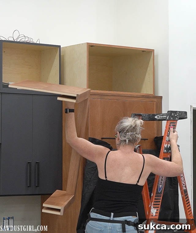 Island trim being meticulously crafted and finished for the kitchen island.