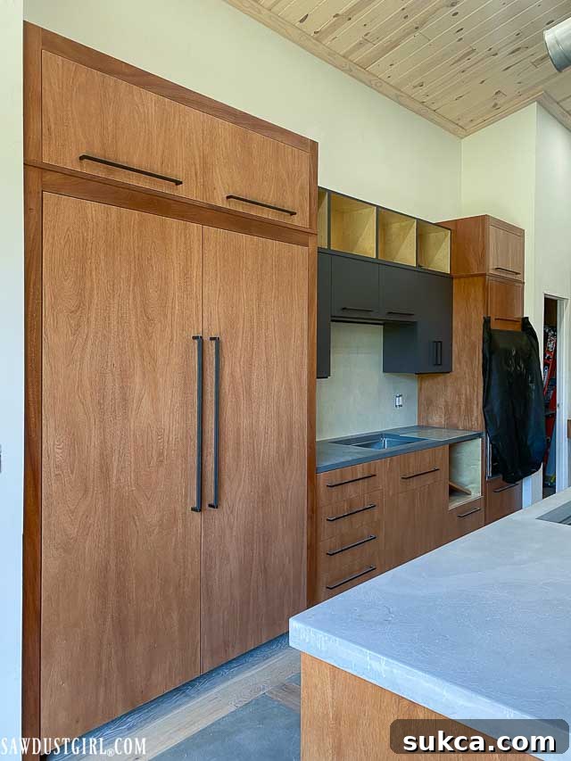 Finished kitchen cabinets awaiting installation, showcasing their smooth, painted surfaces.