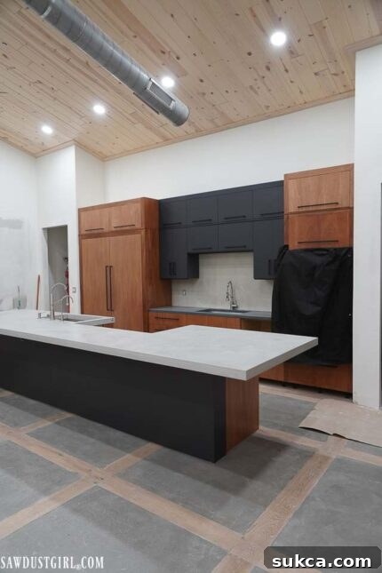 Full view of a section of the finished kitchen cabinets, showcasing the renovated proportions.