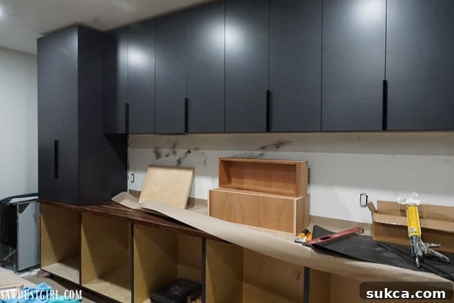 A wider shot of the ongoing pantry construction, showing more of the overall progress and layout.