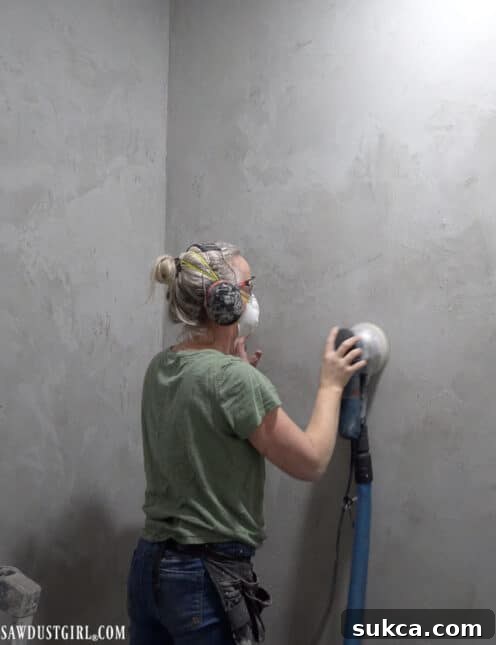 Powder room floor and wall with unique concrete finish