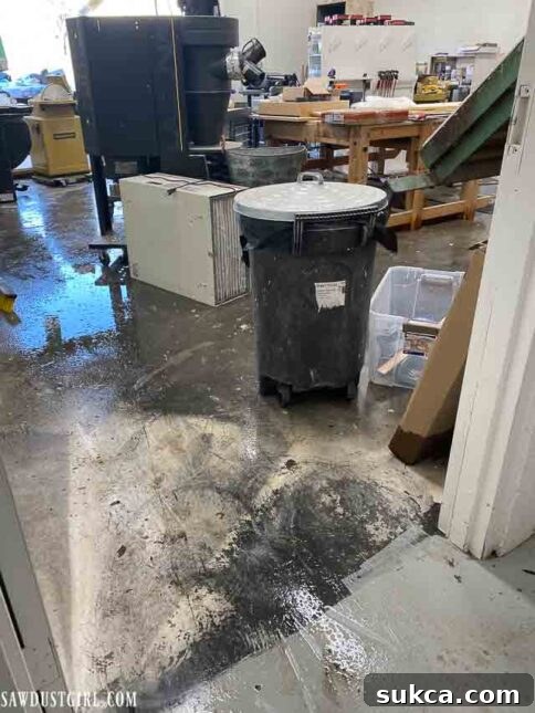 Flooded workshop floor after the plumbing disaster