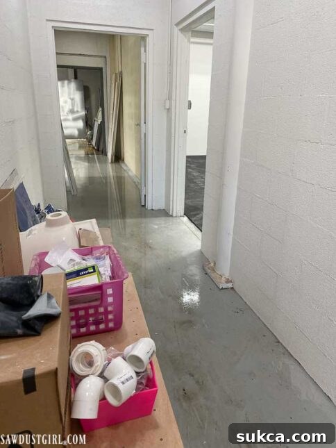 Water damage visible across the main floor of The Lodge