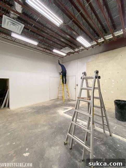 Prepping the gym room for rubber flooring installation