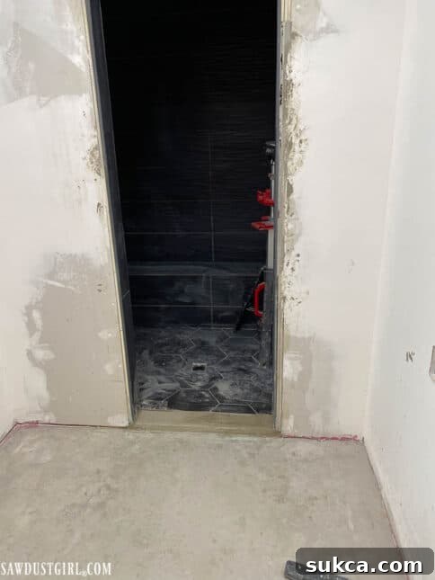 Tiling the shower walls in the master bathroom
