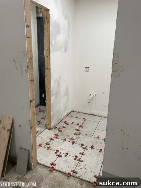 Completed section of the master bathroom shower tiling