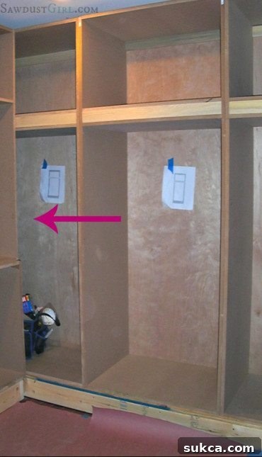 Custom built-in closet progress with tall cabinets installed