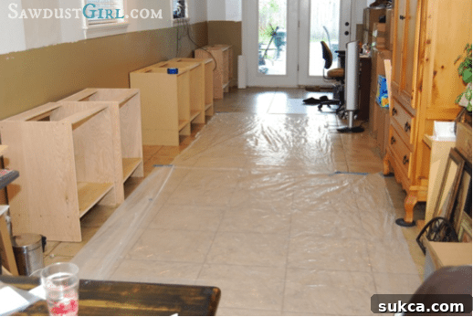 Protecting the floor before priming custom office cabinets