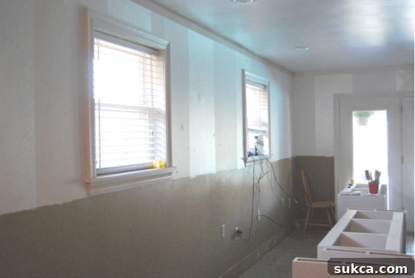 Cara's office built-ins progress: freshly painted walls setting the stage for custom cabinetry