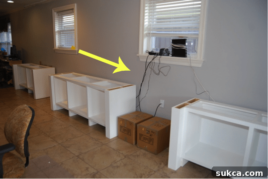 Overview of the custom built-in office space, highlighting the challenge of future wire management