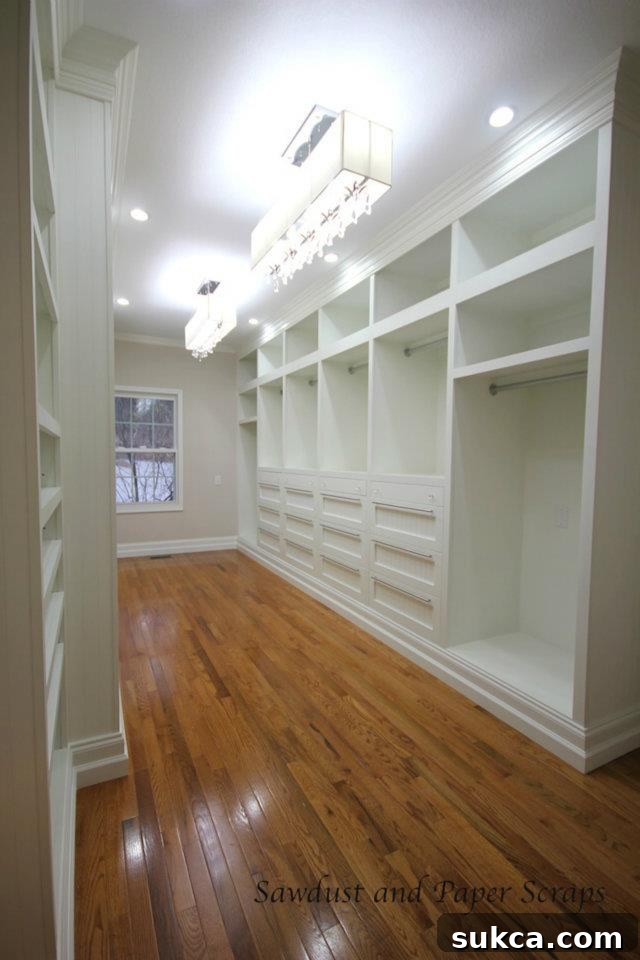 White painted cabinets in built-in closet, highlighting craftsmanship and detail