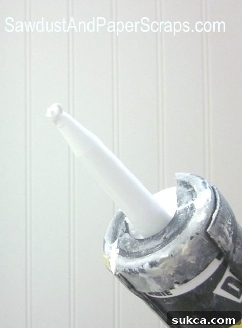How to Keep Caulk from Drying Out - Form a Caulk Ball Detail of a caulk nozzle with a fresh caulk ball covering the opening for perfect preservation