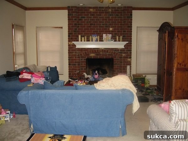 Illinois living room before renovation, showing old carpet and outdated decor