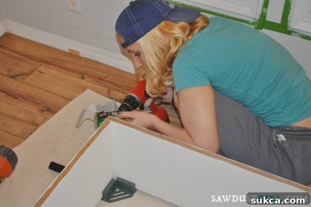 Fawn and husband collaborating to build custom bookshelves for their home library project