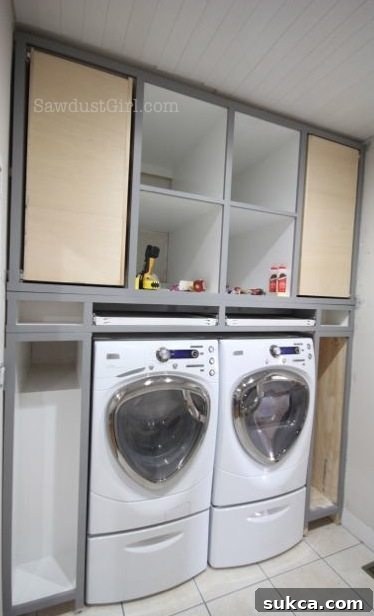 Installing the pull-out drying rack with drawer glides into the custom cabinet.