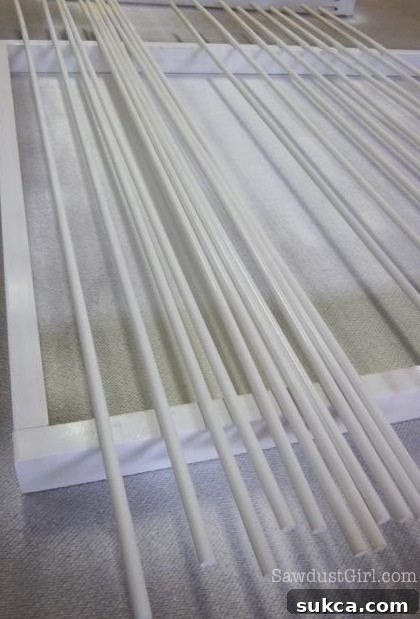 Pine frame pieces and dowels painted before final assembly.